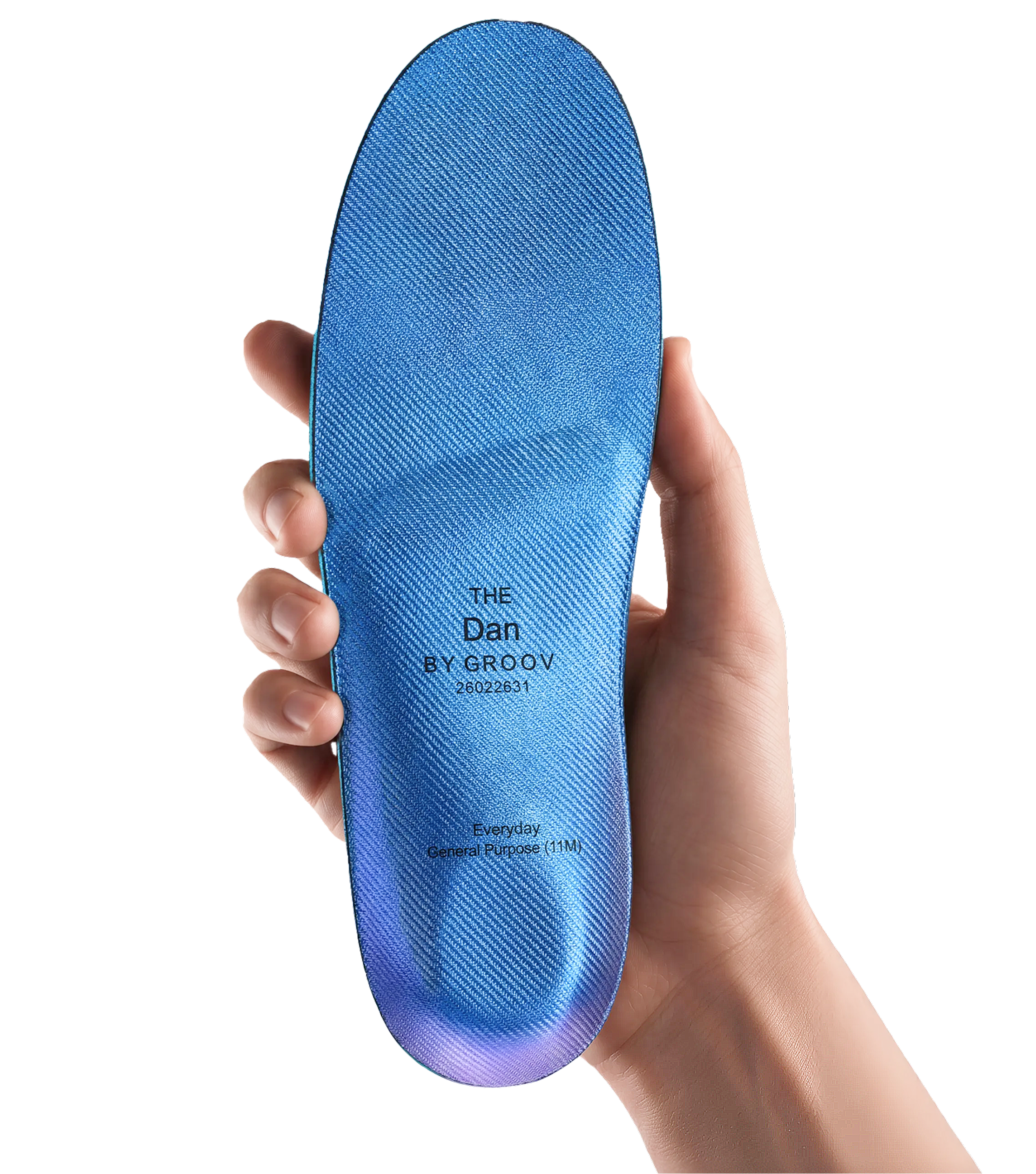 A hand holding The Everyday custom insole.
