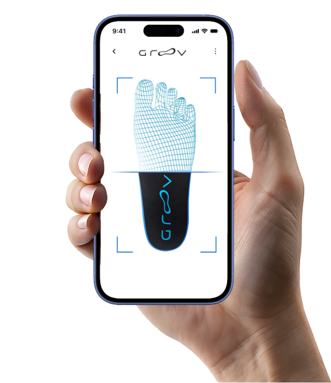 An iPhone scanning a foot while held in one hand.