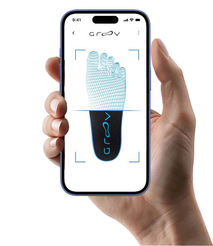 An iPhone scanning a foot while held in one hand.